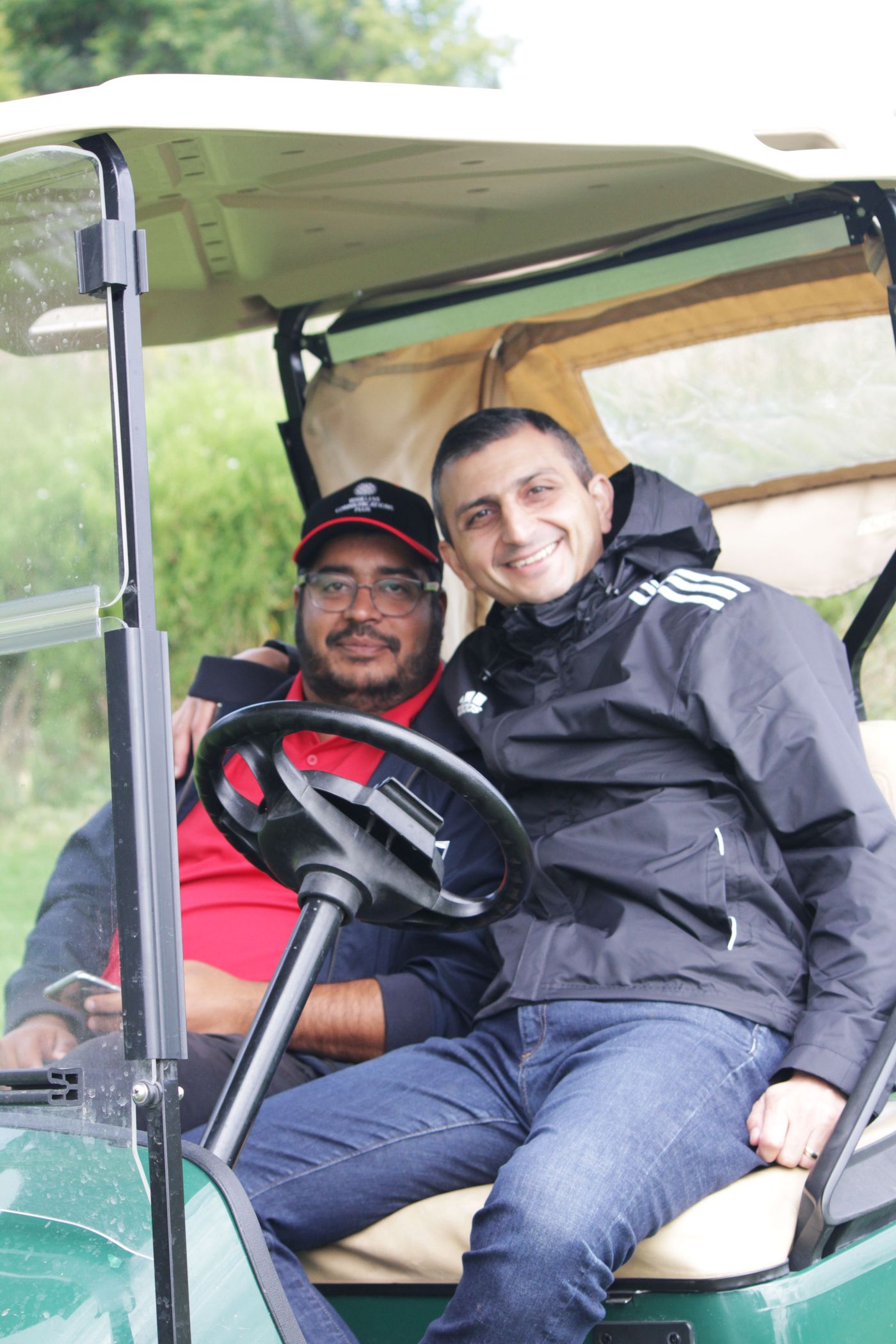 WCP team members sharing a laugh at the annual golf tournament